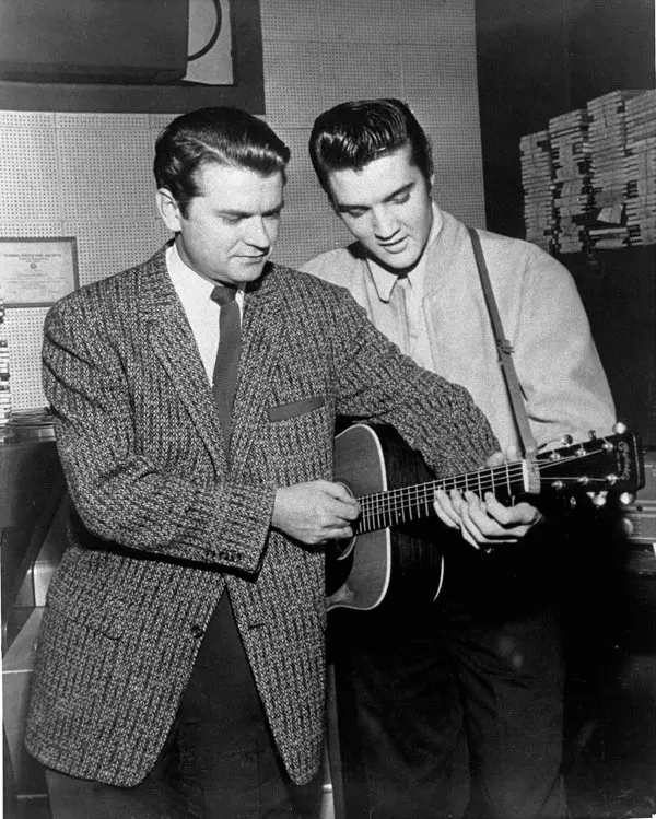 Sam Phillips and Elvis Presley in Sun Records recording studio.